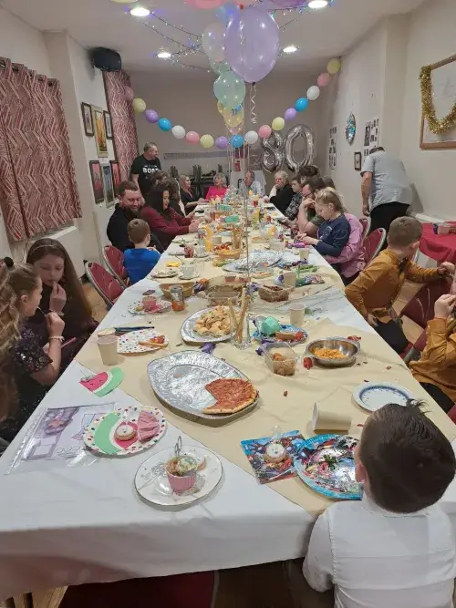 Family Party in decorated Silk Willoughby Village Hall